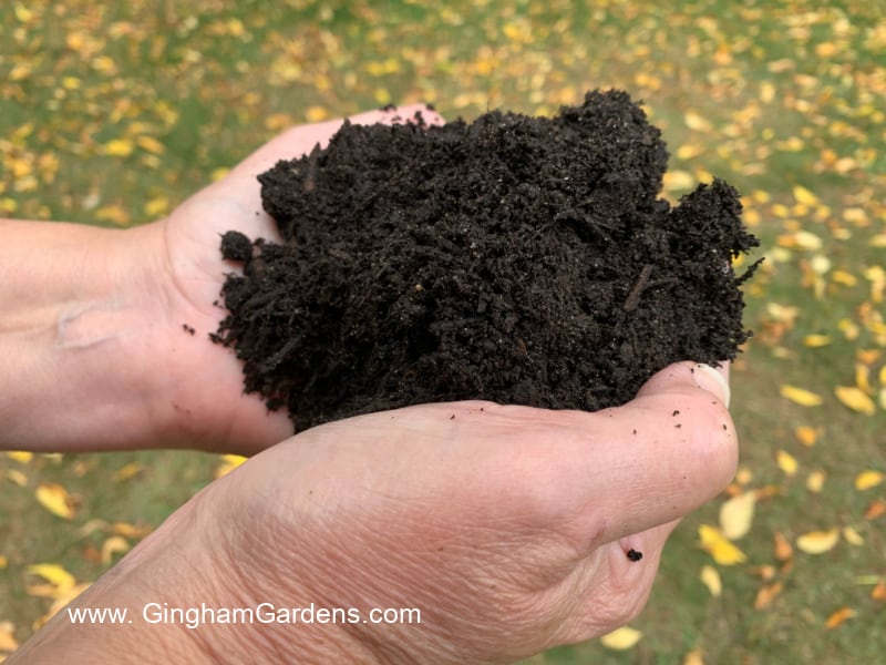 Image of Gardener's hands holding compost