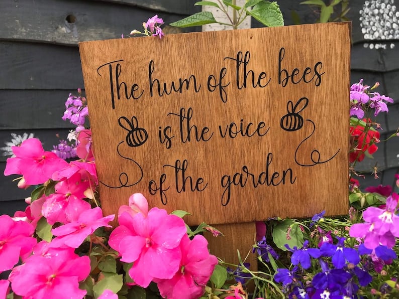 Garden Sign that says The hum of the bees is the voice of the garden