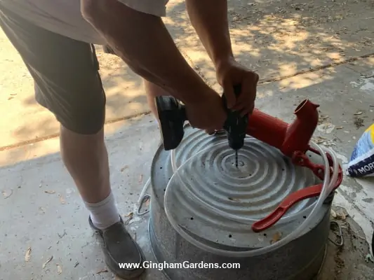 DIY Vintage Pump Fountain and Planter - Process - Drilling holes in galvanized container