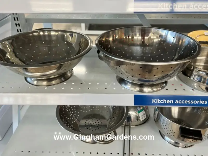 Colanders in a thrift store.