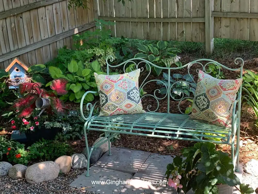 Garden bench in a shade garden.