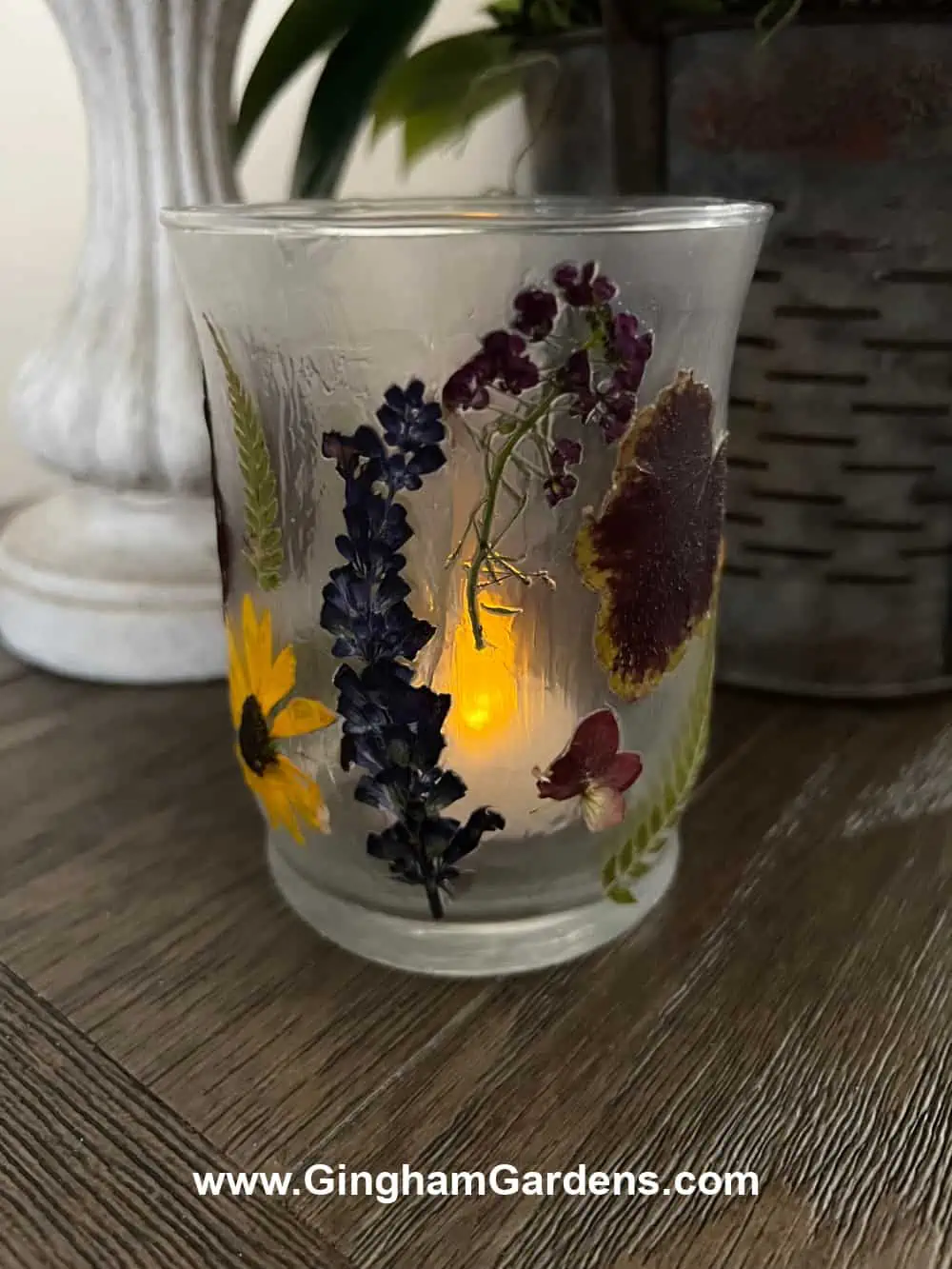 Pressed flower glass candle holder.