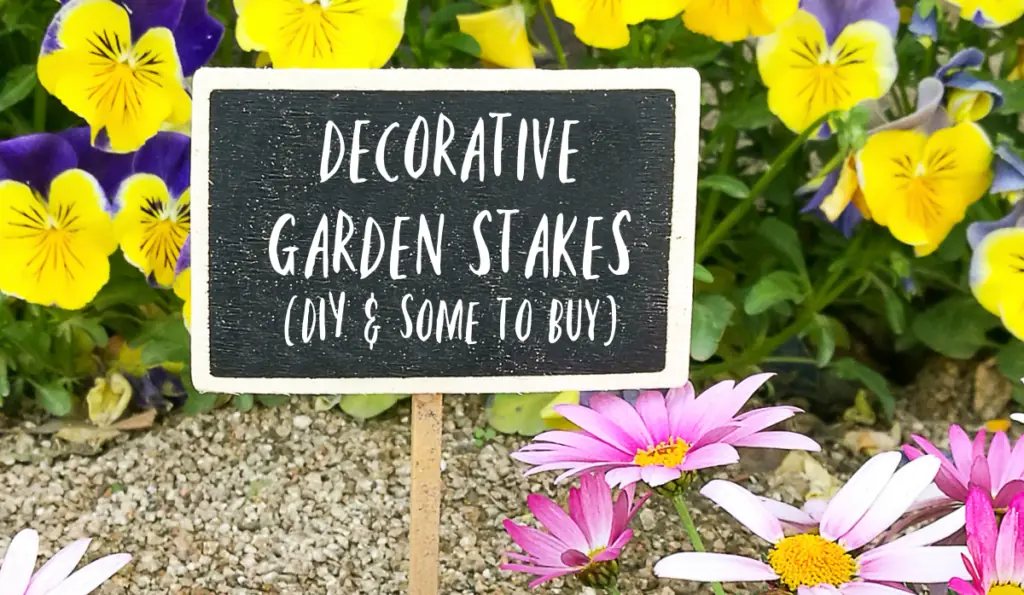 Chalkboard sign in a flower garden with writing - Decorative Garden Stakes (DIY & Some to Buy)